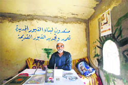 Abu Yusef, the caretaker of the ancient shrine to Guru Nanak, sits in his lodgings in the Sheikh Marouf Junaid al-Baghdadi cemetery in Karkh district of Baghdad. 