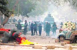 The Egyptian riot police confronts protesters in Cairo. 
