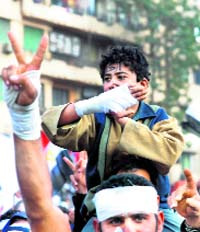 Wounded demonstrators protest at Cairos Tahrir Square on Friday.