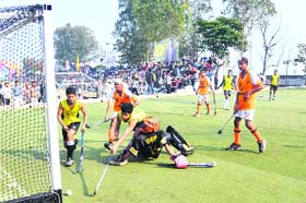 Hockey players in action during six-a-side match at Kila Raipur