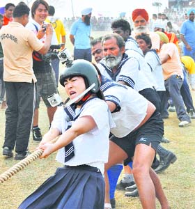 JAPANSESE POWER: Inioto, a Japanese, leads her team in a tug-of-war event at Kila Raipur