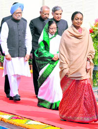 President Pratibha Patil, accompanied by PM Manmohan Singh, Lok Sabha Speaker Meira Kumar proceeds to address the joint session of Parliament to mark the beginning of the Budget session, in New Delhi on Monday.