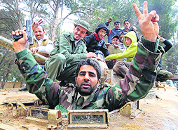 A man fires a celebratory shot in the air in the Libyan town of Shahat. 