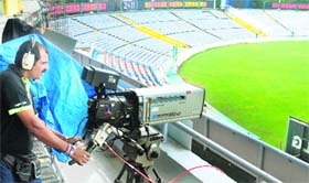 A cameraman places his equipment at the PCA stadium in Mohali