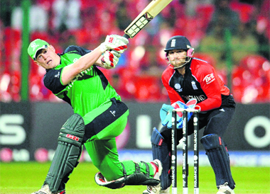 Irelands Kevin OBrien, who scored the fastest century in World Cup history off just 50 balls, plays a shot during the match against England on Wednesday. Set to score 328 for a win, Ireland caused the biggest upset of this World Cup by defeating England by three wickets in a dramatic run chase. 
