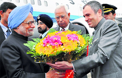 Prime Minister Dr Manmohan Singh being welcomed by J&K Governor NN Vohra and Chief Minister Omar Abdullah during his one-day visit to Jammu on Friday.