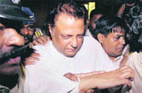 Hasan being produced in the sessions court in Mumbai on Tuesday.