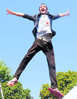 Soaring High: A student tries a stunt at Rose Festival, Panjab University