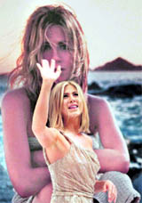 Hollywood actor Jennifer Aniston waves after signing autographs during the launch of her new perfume in Mexico City.