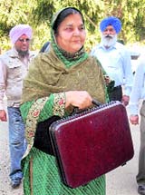 Punjabs Finance Minister Upinderjit Kaur walks in to present the budget. She is the first woman Finance Minister in the country. 