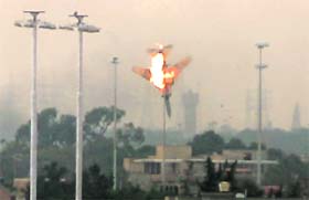 A Libyan jet bomber goes down in flames after being shot in Benghazi