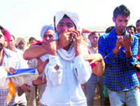 Cops gag teachers who demonstrated with black flags at the SAD rally on Wednesday.