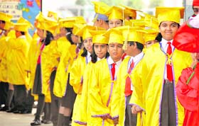 Students wait for their turn to get degrees at a graduation ceremony held at BCM Senior Secondary School in Ludhiana