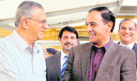 Pakistans Interior Secretary Qamar Zaman with his Indian counterpart GK Pillai on his arrival at the IGI airport in New Delhi on Sunday. 