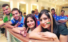 BLUE BRIGADE: Fans gear up for the India-Pakistan World Cup cricket match at the Tress Lounge-8 on Tuesday