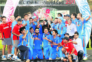 Team India celebrate with the coveted trophy after winning the Cricket World Cup at the Wankhede Stadium in Mumbai 
