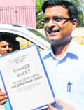 A CBI official with the chargesheet in the 2G Spectrum scam in New Delhi 