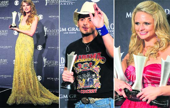 L-R: Taylor Swift holds her Entertainer of the Year award backstage at the 46th annual Academy of Country Music Awards in Las Vegas. Brad Paisely poses with the award for Male Vocalist of the Year backstage, singer Miranda Lambert poses with her four ACM awards. Lambert retained her crown as the top female vocalist and her wistful tune The House That Built Me was honoured for single, song and video of the year at the ceremony