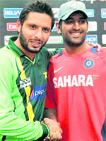 A file photo of Shahid Afridi with MS Dhoni after the Mohali World Cup semifinal 