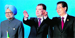 (From left) PM Manmohan Singh, Russian President Dmitry Medvedev and Chinese President Hu Jintao at the one-day BRICS summit in Sanya, China, on Thursday.