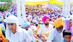Devotees throng Takht Sri Damdama Sahib on the occasion of Baisakhi at Talwandi Sabo on Thursday.