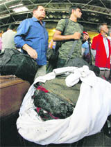 Rajdhani Express passengers upon their arrival at the New Delhi railway station on Monday. 