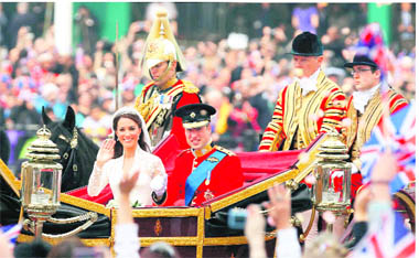 Britains Prince William and his wife Catherine, Duchess of Cambridge, travel to Buckingham Palace in the 1902 State Landau after their wedding in Westminster Abbey in central London on Friday; (and top right) the groom places the ring on the finger of his bride. 