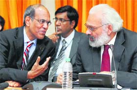 RBI Governor D Subbarao interacts with the Deputy Governor Subir Gokarn during the RBIs credit policy review meeting in Mumbai on Tuesday