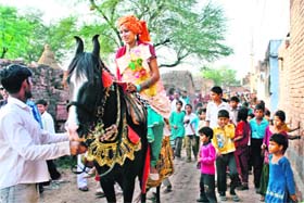 Monica undertakes ghurcharhi in Kaparwas village in Bhiwani on the eve of her marriage