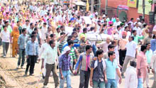 Protesters and victims relatives, with the minors body, block the NH-1, demanding the arrest of her killers, in Kurukshetra on Friday. 