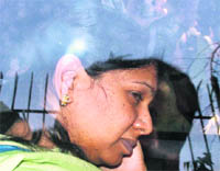 DMK MP Kanimozhi leaves Patiala House Court after appearing before a special CBI judge in the 2G scam case, in New Delhi. 