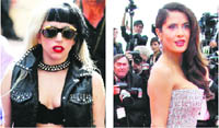 Lady Gaga and Salma Hayek pose on the red carpet for the opening ceremony of the 64th Cannes Film Festival in Cannes
