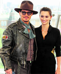 Actors Johnny Depp and Penelope Cruz pose for photographers in front of the Kremlin during a news conference in Moscow. Depp and Cruz will attend the Russian premiere of their new film Pirates of the Caribbean: On Stranger Tides on Wednesday