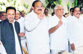 Karnataka Chief Minister BS Yeddyurappa with BJP leader M Venkaiah Naidu and MLAs in Bangalore on Monday
