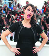 Blink & not to miss: Actress Berenice Bejo grimaces during a photo-call for the film The Artist in competition at the 64th Cannes Film Festival.
