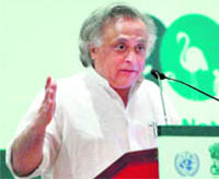 Environment & Forests Minister Jairam Ramesh speaks at a conference in New Delhi on Monday.