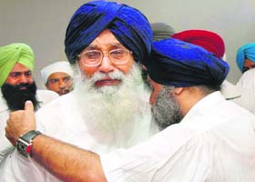 Punjab Chief Minister Parkash Singh Badal and his son and Deputy CM Sukhbir Singh break down near the body of Surinder Kaur Badal in their native Badal village on Wednesday