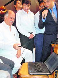 Union Minister of State Gurudas Kamat launches the service in Chandigarh on Wednesday