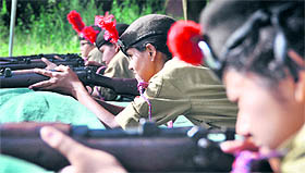 NCC cadets from different colleges hone their shooting skills during a training camp at the Khalsa College for Women in Ludhiana on Sunday.