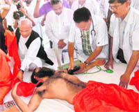 Doctors examine Ramdev at Haridwar on Wednesday.