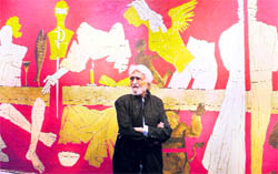 MF Hussain with his painting titled Last Supperat an exhibition in Mumbai