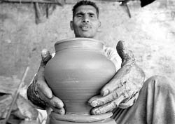 A potter moulds a pitcher in Ludhiana