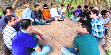 Kashmiri Pandits and Muslims gather for a chat at a park on the banks of Dal Lake in Srinagar 
