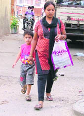 keeping company A child walks with his mother in Ludhiana on Sunday