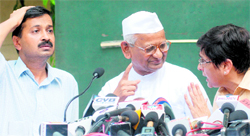 Anna Hazare, Arvind Kejriwal and Kiran Bedi at a press meet in New Delhi on Wednesday