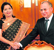 Foreign Secretary Nirupama Rao shakes hand with Pakistani counterpart Salman Bashir in Islamabad on Thursday.