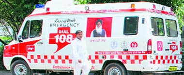 The Chief Ministers picture on an ambulance received under the NRHM. Laxmi Kanta Chawlas picture is on the other side.