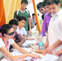 ABVP activists guide students at a help desk in Panjab University, Chandigarh, on Friday.
