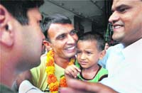 Released sailor Ravinder Singh of Rohtak is greeted by his family members upon arrival at the IGI Airport in New Delhi