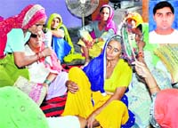 The distraught mother and other relatives of Hayatpur village sarpanch Rakesh (inset)